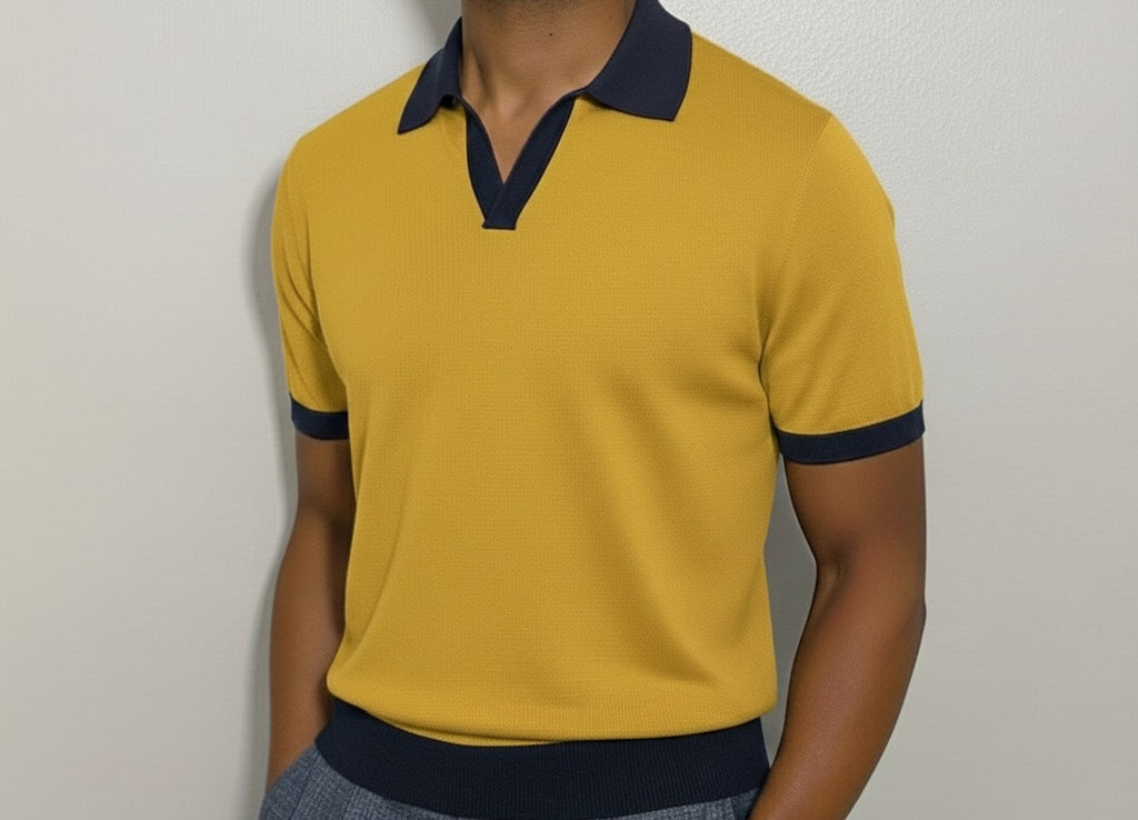 Yellow polo shirt with navy accents worn by a person against a plain background