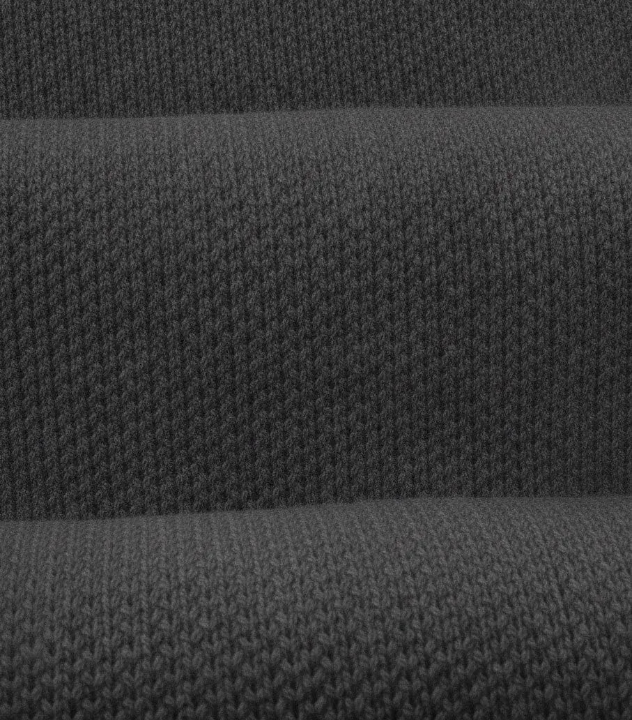 Close-up of dark gray fabric with a textured pattern