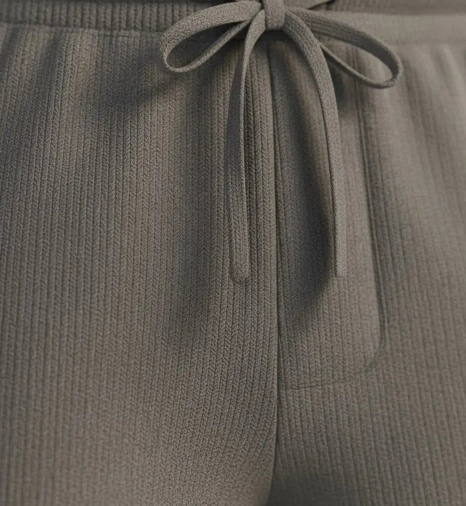 Close-up of a Gray pure BCI Cotton shorts with a drawstring on a white background 
