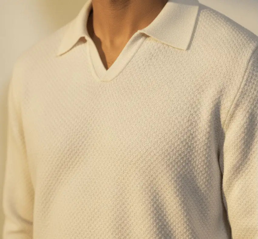 close up White BCI Cotton long sleeve V-Neck Polo with white background on model