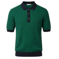Green pure BCI Cotton polo shirt with navy collar and cuffs on a white background
