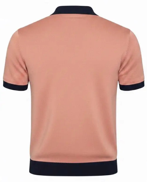 Salmon v-neck polo shirt with black trim on a white background