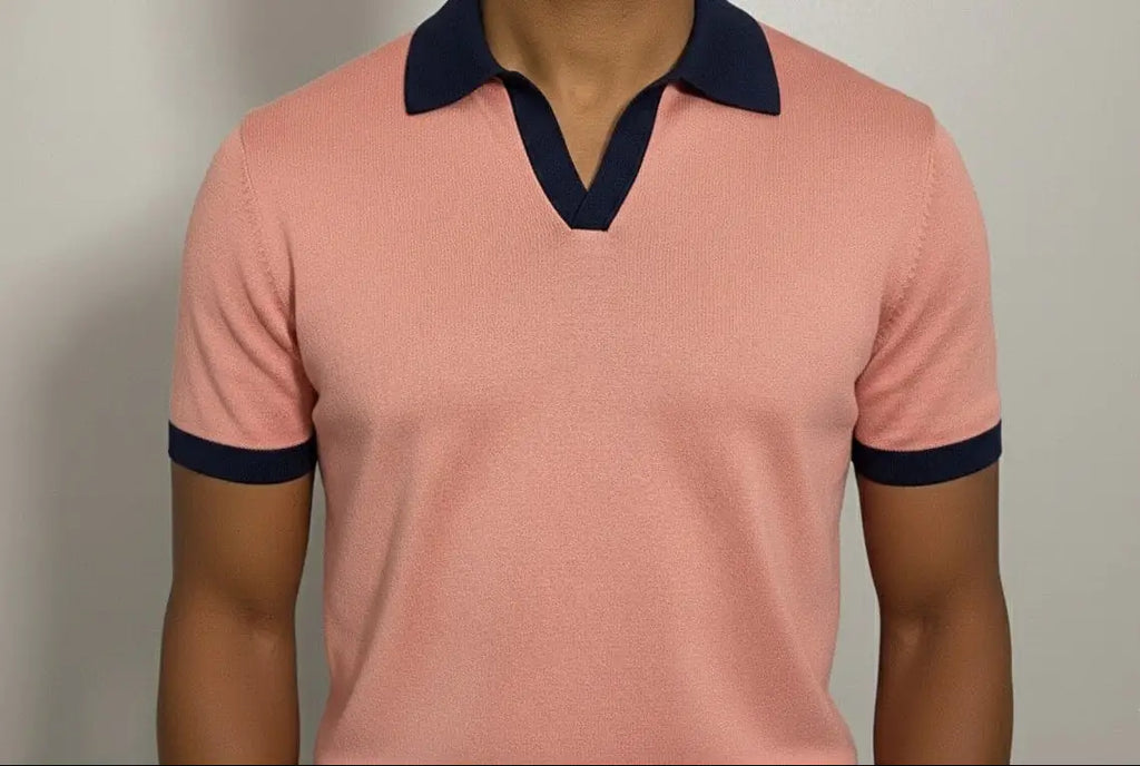 Salmon v-neck polo shirt with navy accents on a plain background