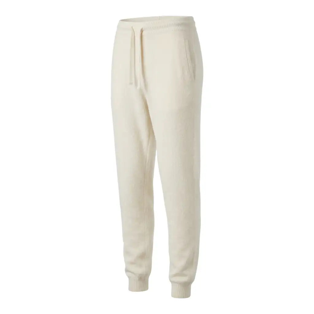 Pure White cashmere joggers in a three-quarter side view